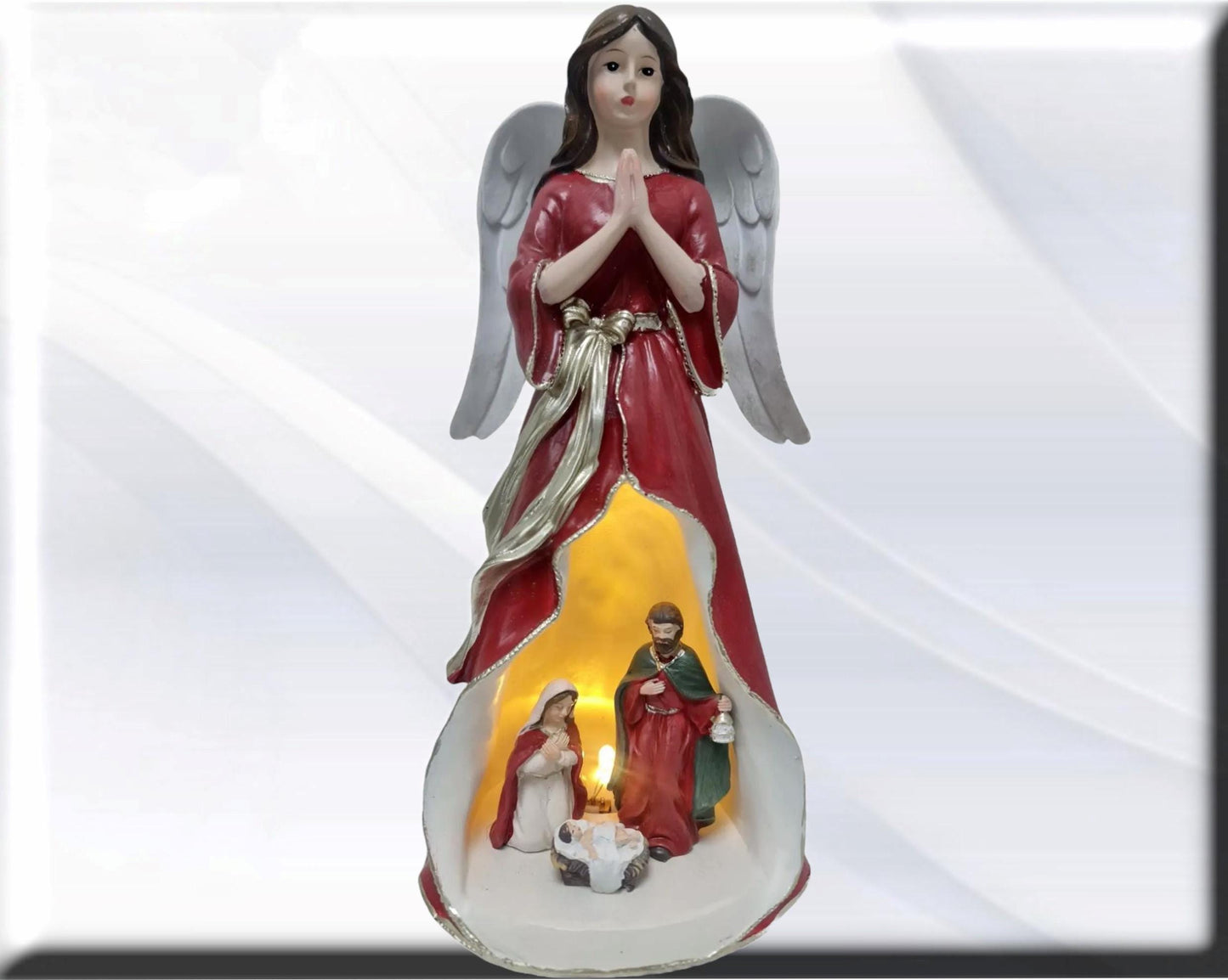 Angel statue with Holy Family , Catholic virgins and saints