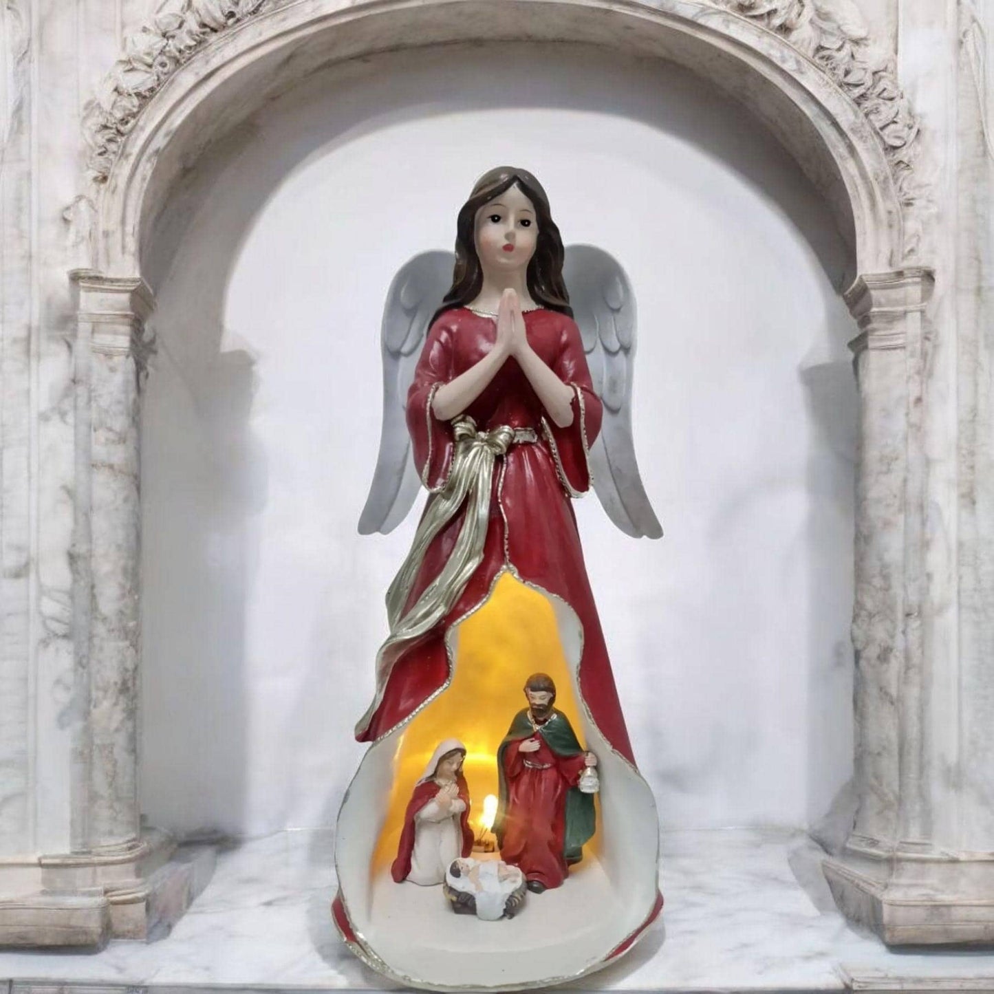 Angel statue with Holy Family , Catholic virgins and saints