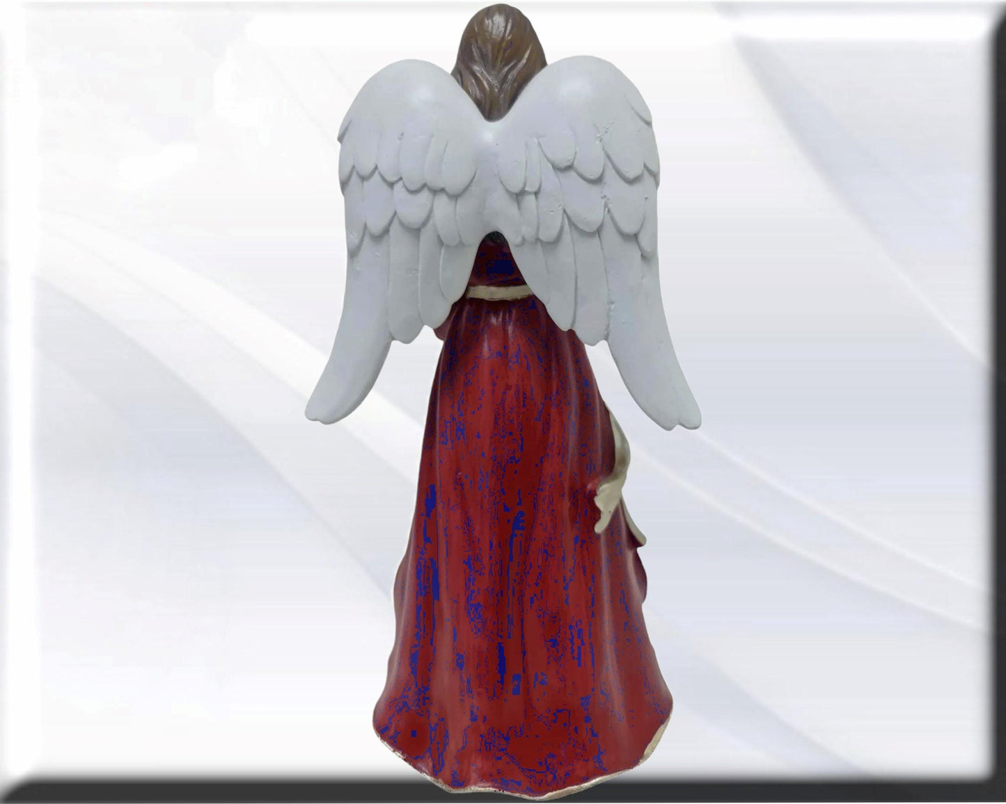Angel statue with Holy Family , Catholic virgins and saints