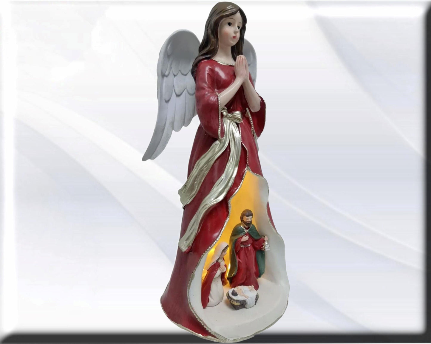 Angel statue with Holy Family , Catholic virgins and saints