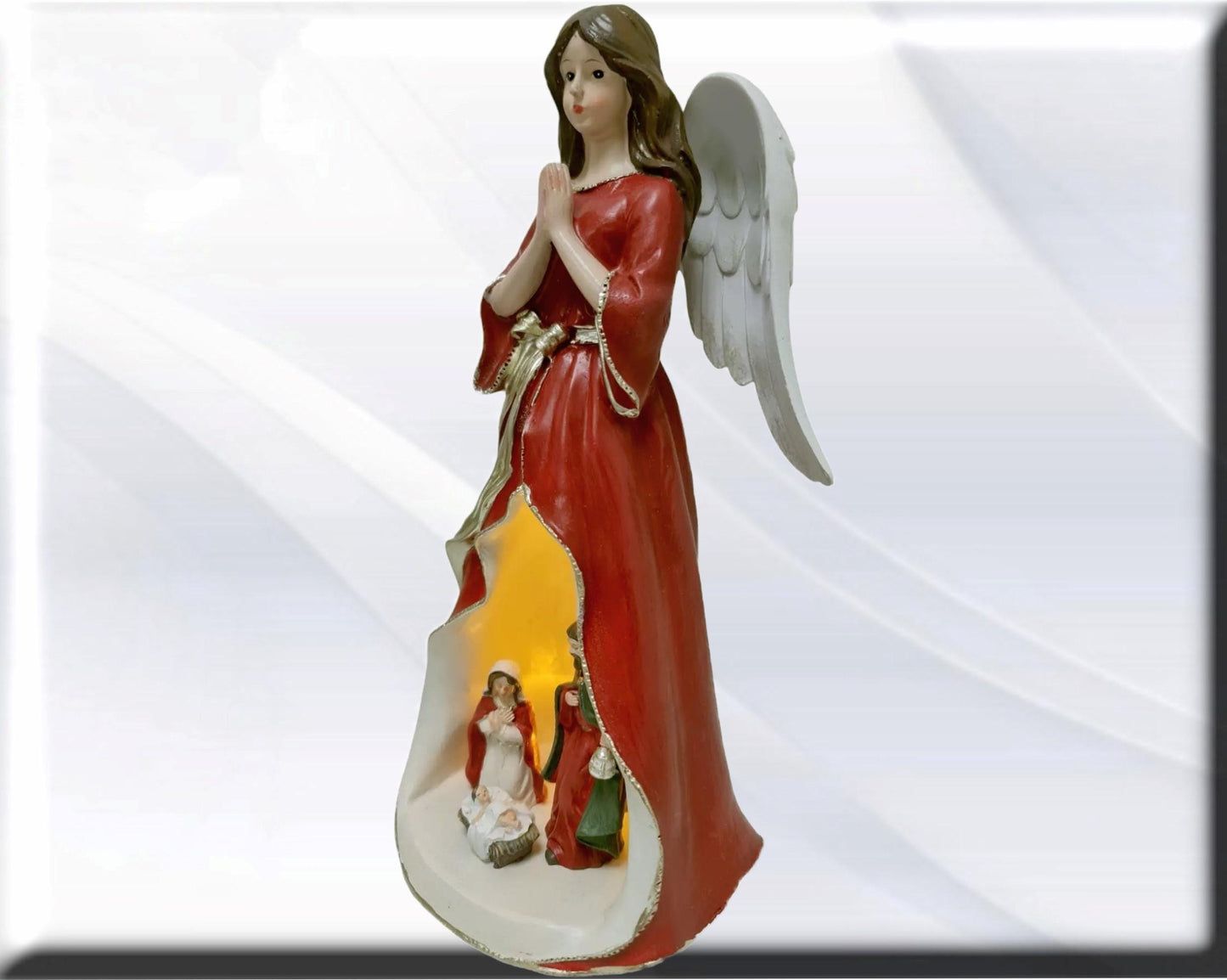 Angel statue with Holy Family , Catholic virgins and saints