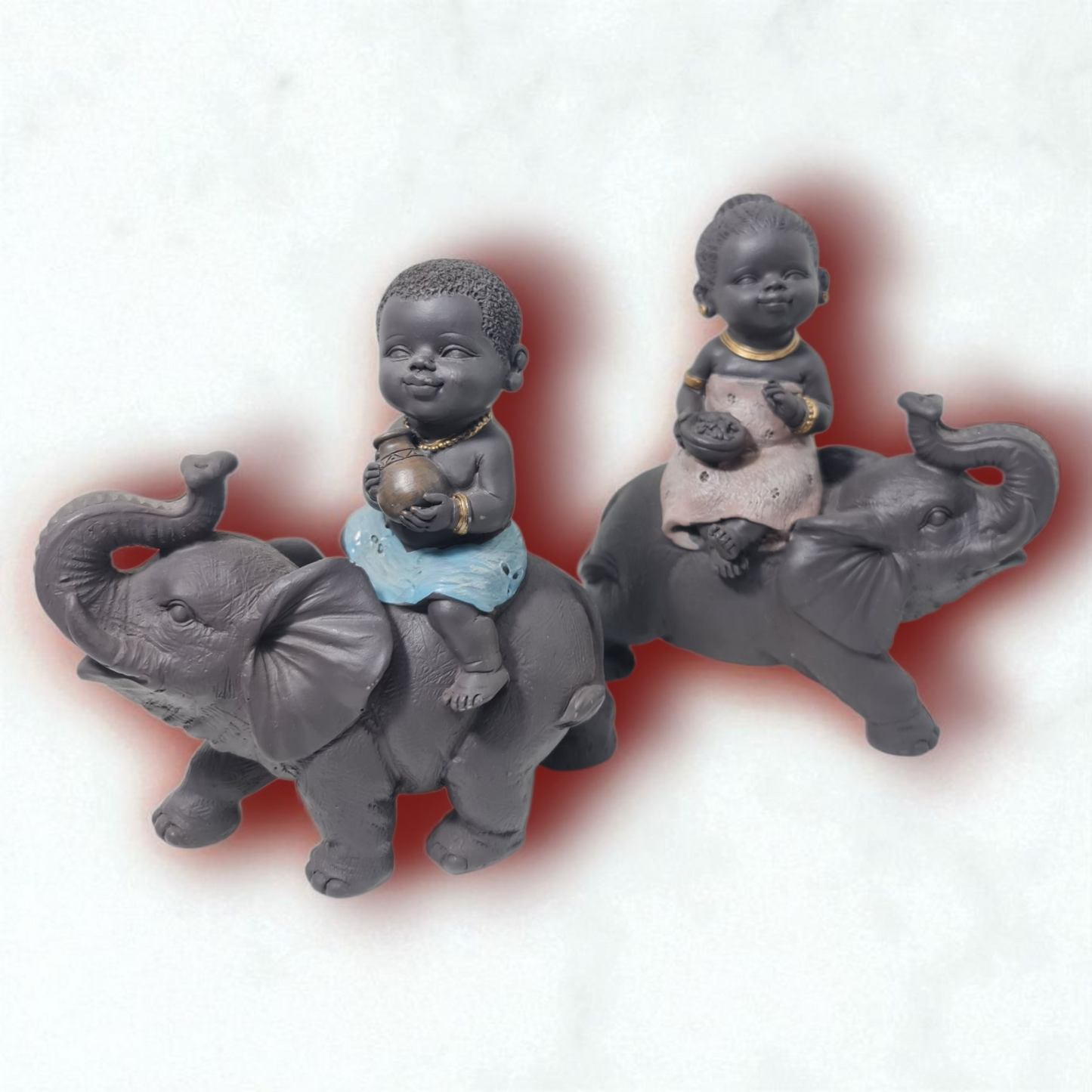 pareja de figuras sentadas sobre elefantes , decoracion del hogar